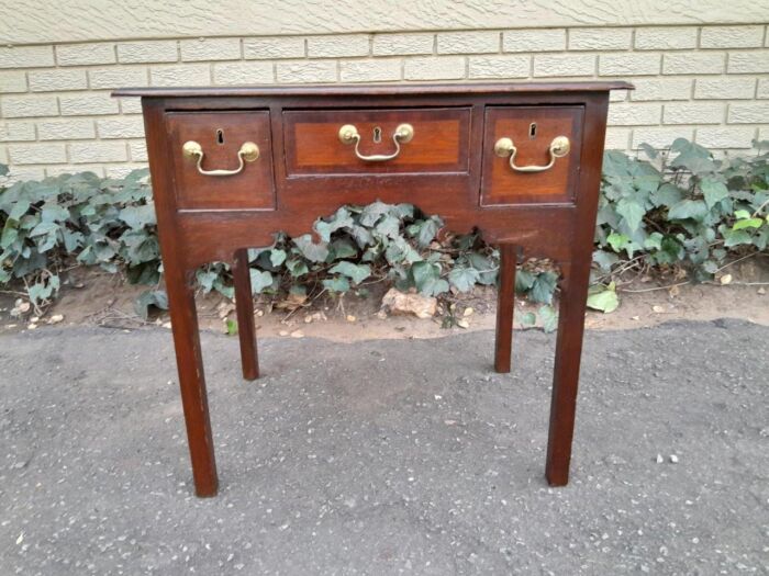 An 18th/ 19th Century Georgian Oak and Mahogany Lowboy with Drawers and Brass Handles