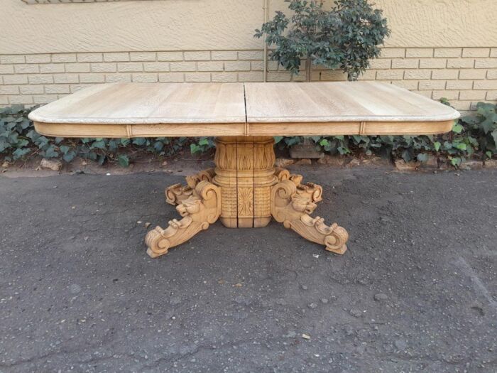 A 19th Century Heavily Carved Oak Extending Table  With Three Extensions