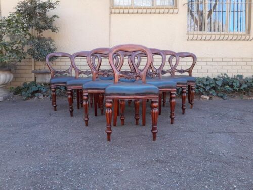 An Early 20th Century Victorian Set Of Ten Bustle Back Chairs Upholstered In Deep Button Leather