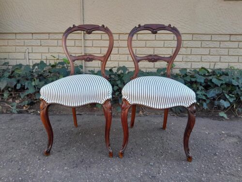 An Antique Pair of Victorian Walnut Chairs