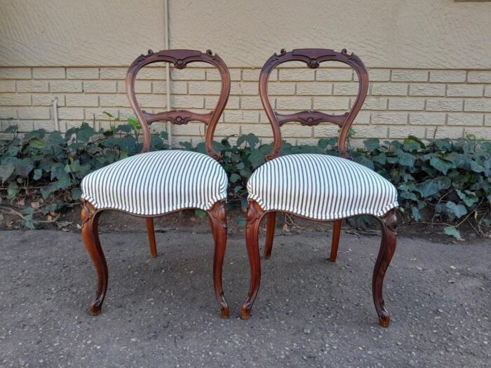 An Antique Pair of Victorian Walnut Chairs