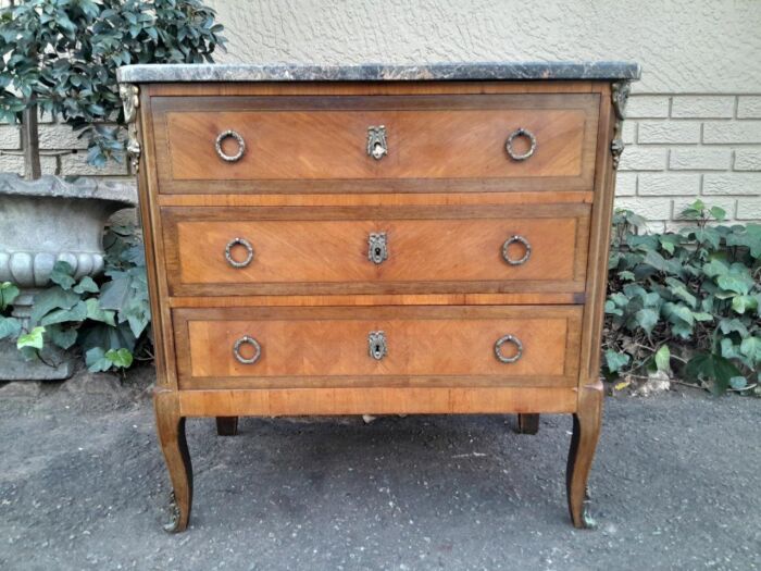 An Antique Kingswood and Gilt Metal Mounted Chest of Drawers with Marble Top