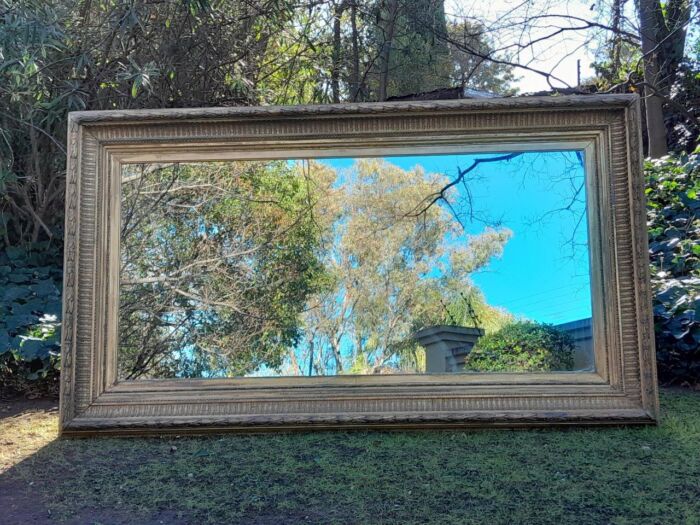 A 19th Century Carved Giltwood And Gesso Mirror Of Large Proportions