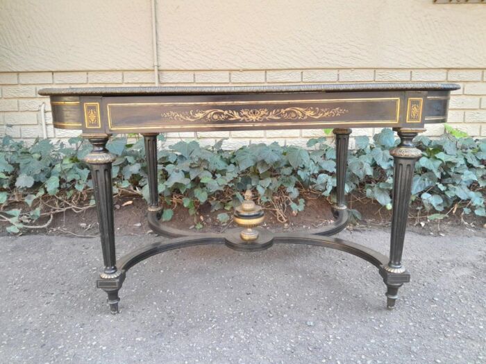 A 19th Century French Ebonised and Brass inlay and Metal Mounted Table with Drawer