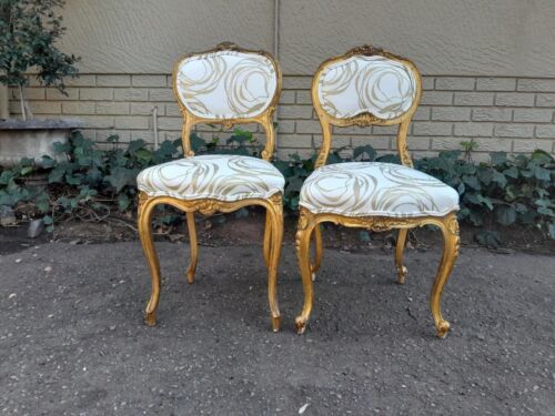 A 19th Century Pair of French Rococo Style Carved Giltwood Chairs Upholstered in a Custom Made Fabric for The Crown Collection