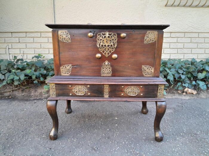 A 20th Century Dutch Colonial Style Oak Chest On Stand With Brass Handles And Mounts With Key