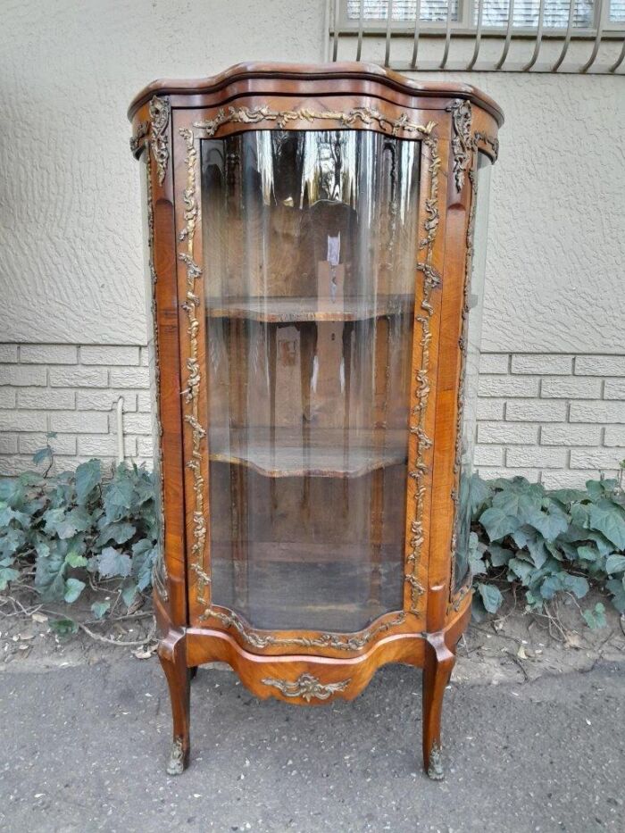 A 20th Century French Mahogany Vitrine With Gilded Metal Embellishments