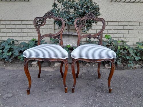 An Early 20th Century Pair Of French Carved Mahogany Chairs