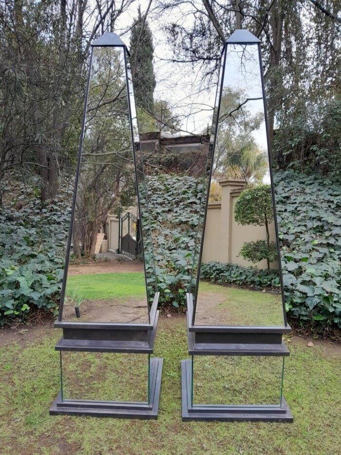 A Pair of Designer Mirror and Antique Coloured Iron Obelisks