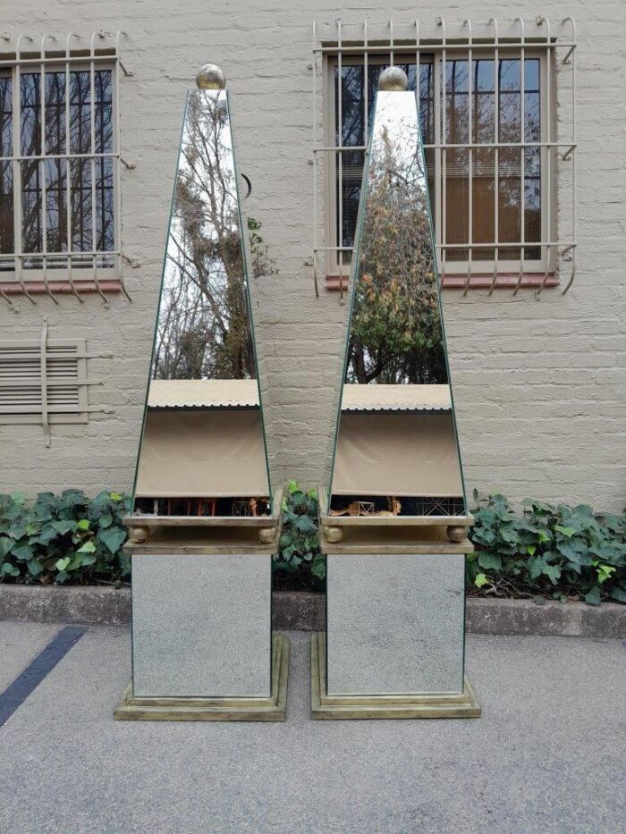 A Pair of Designer Mirror and Antique Gold Coloured Iron Obelisks with Ball Detail