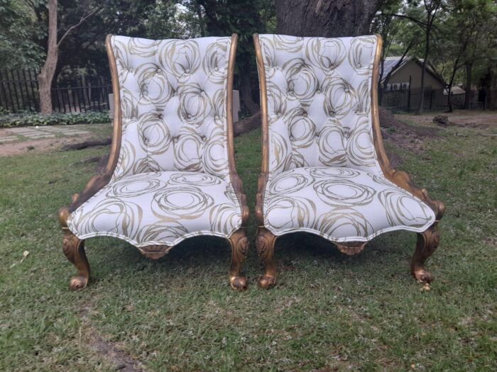 A 20th Century Pair of French Style Gilded Slipper Chairs Upholstered in a Custom Made Fabric