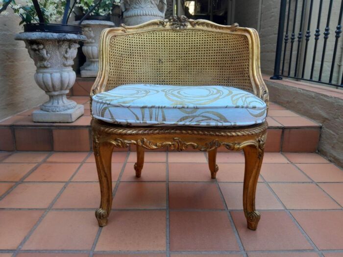 A 20th Century French Style Giltwood Rattan Chair Upholstered In Hand Printed Gold Design Fabric 