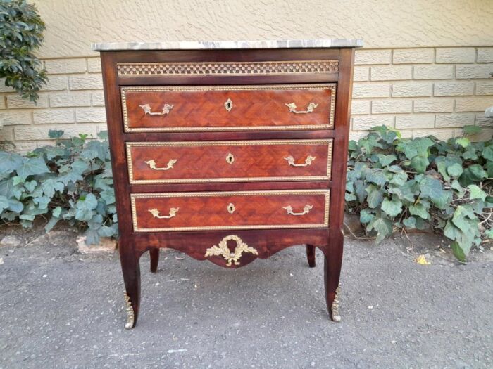 A 20th Century Parquetry Chest Of Drawers With Gilt Mounts And Marble Top