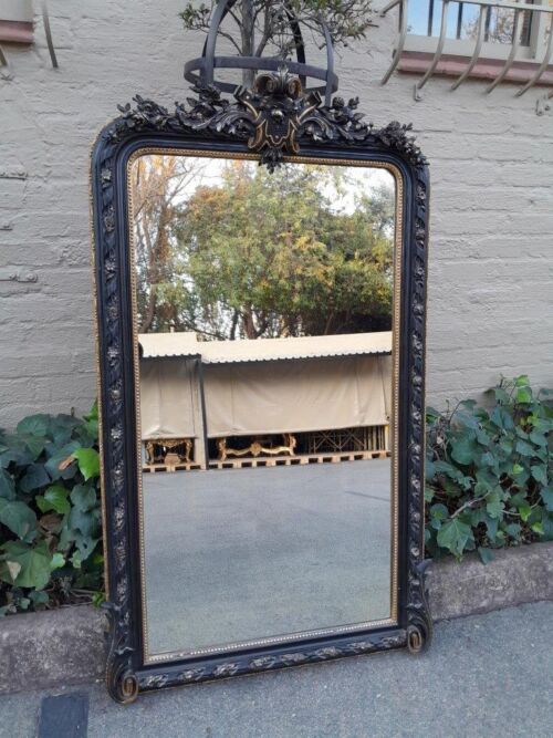 A 20th Century French Style Ebonized Hand-Gilt Ornate Mirror