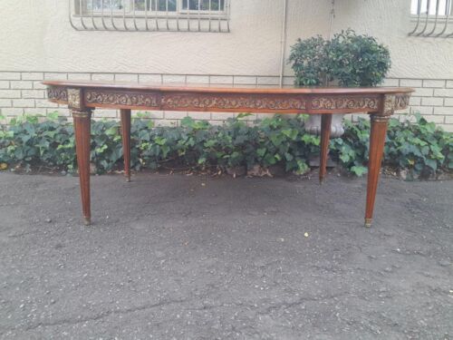 A 20th Century French Style Dining Table with Gold Detail