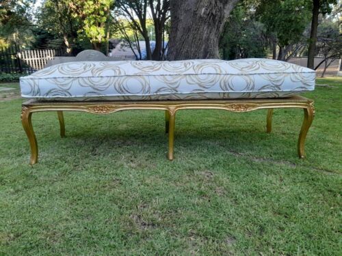 A 20th Century French Style Carved And Gilded Rattan Ottoman /  Bench With Seat Cushion In Hand Made Fabric