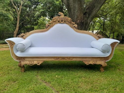 A 20th Century Ornately  Carved Eagle Settee In A Bleached Contemporary Finish Upholstered In A Slubby Linen