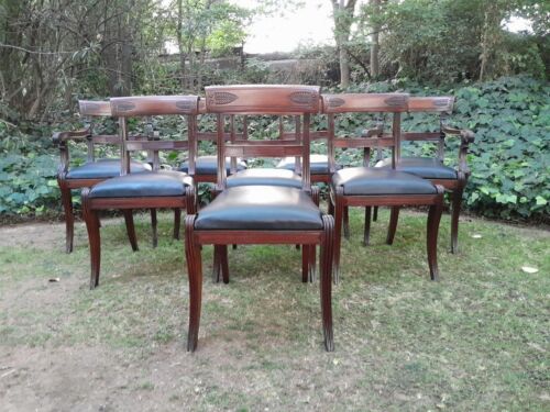 An Antique Late 18th / Early 19th Regency Set of Eight  Mahogany Dining Chairs Upholstered inleather. Comprising: A pair of Carvers and Six Side Chairs