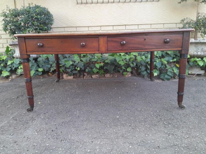 An Antique Early 19th Century George IV Mahogany Writing With Gilt Tooled Leather Top And Drawers With Brass Cap