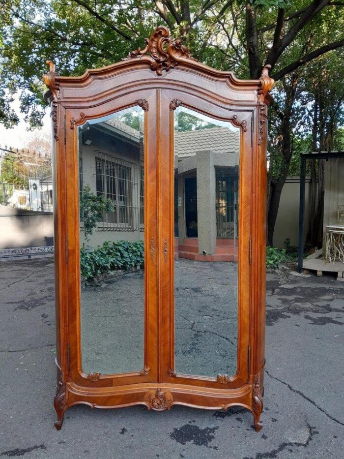 A 20th Century French Louis XV Style Walnut Armoire with Bevelled Mirrors