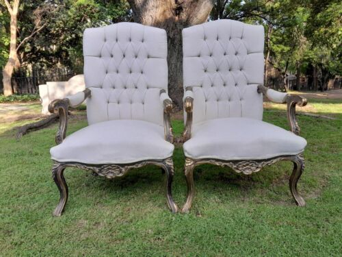 A 20th Century Pair Of French Style Carved And Giltwood High-Back Chairs In Leather