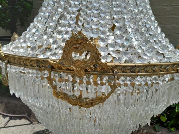 A 20th Century Empire French Style Brass and Crystal Chandelier of Large Proportions - Image 4