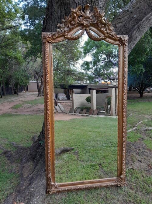 A French Rococo Style Ornately Carved & Gilded Bevelled Mirror