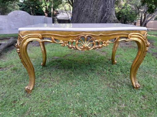 A French Style Ornately Carved Coffee Table with Marble Top