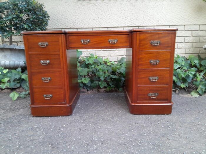 An Antique Victorian Mahogany Desk With Tooled Leather Top