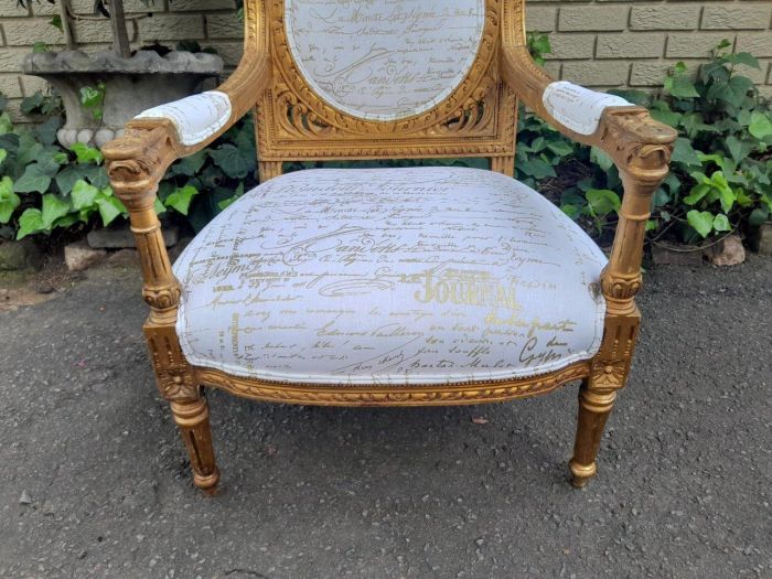 A 20th Century Pair Of French Ornately Carved And Gilded Armchairs - Image 6