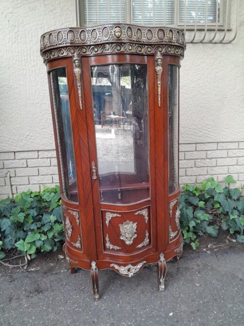 An Antique 20th Century French Ornate Style Mahogany Vitrine with Metal Mounts