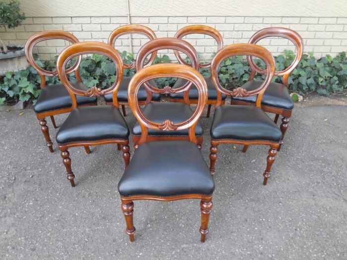 A 20th Century Set of Eight Victorian Style Mahogany Dining Chairs Upholstered in Leather - Image 2