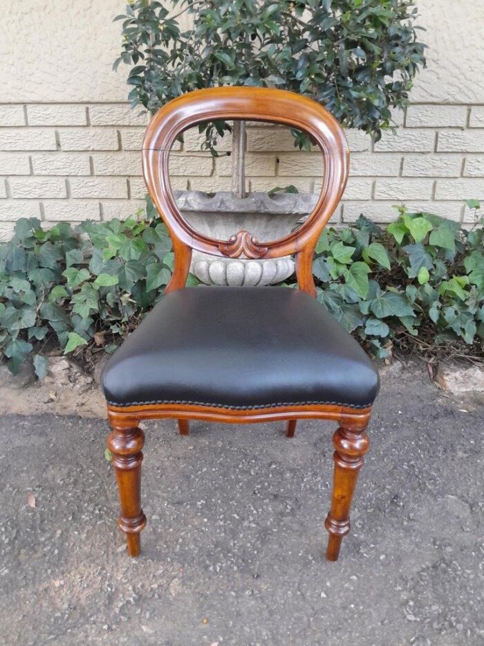 A 20th Century Set of Eight Victorian Style Mahogany Dining Chairs Upholstered in Leather - Image 4