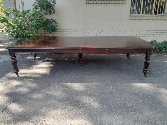 An Antique and Massive Victorian Mahogany Extending Table with Two Extensions and Original Castors and Crank Handle - Image 2