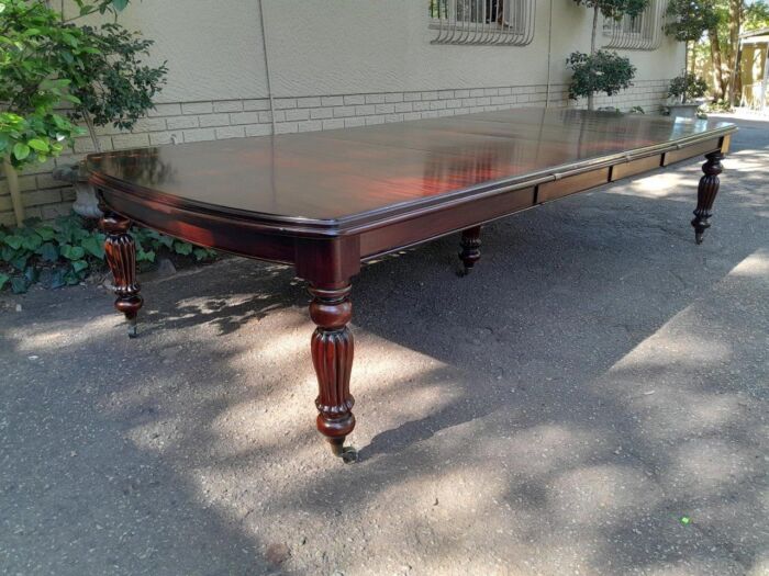 An Antique and Massive Victorian Mahogany Extending Table with Two Extensions and Original Castors and Crank Handle - Image 3