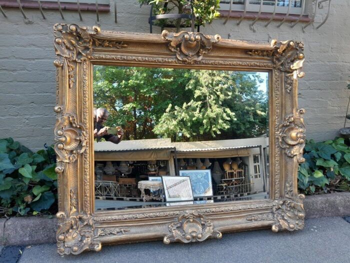 An Extremely Large 20th Century French Style Ornately Carved and Bevelled Mirror