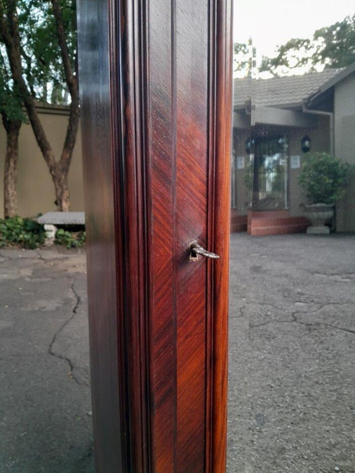 An Early 20th Century French Carved Rosewood Armoire with Bevelled Mirror and Lock and Key - Image 7