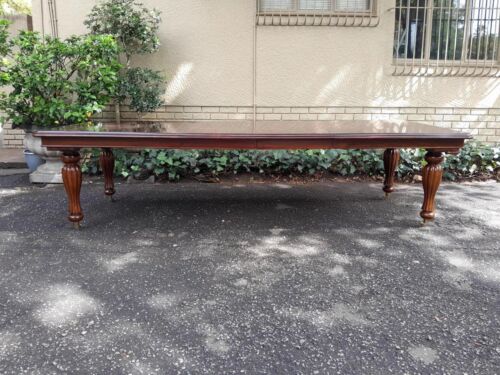 A 20Th Century Mahogany Extending Table with Two Extensions