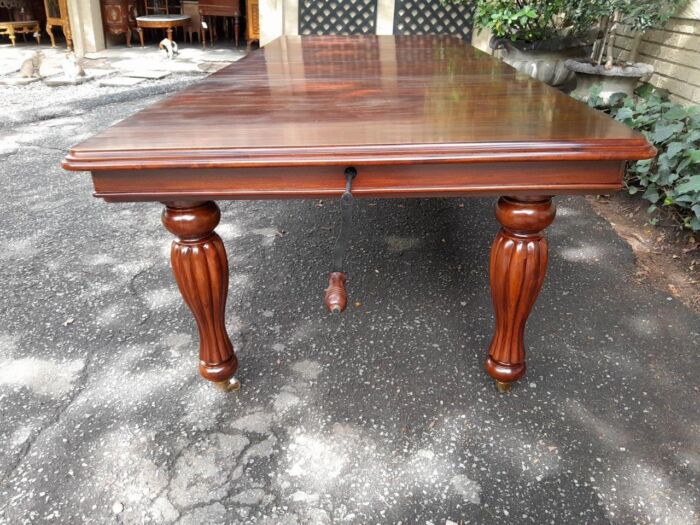 A 20Th Century Mahogany Extending Table with Two Extensions, on Brass Castors with Crank Handle - Image 5