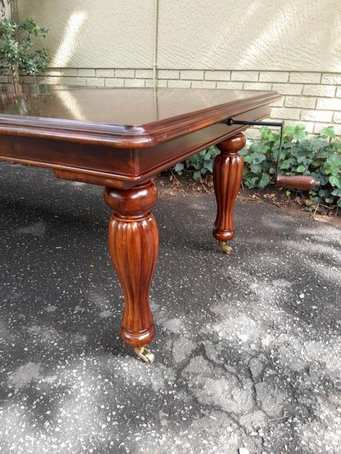 A 20Th Century Mahogany Extending Table with Two Extensions, on Brass Castors with Crank Handle - Image 6