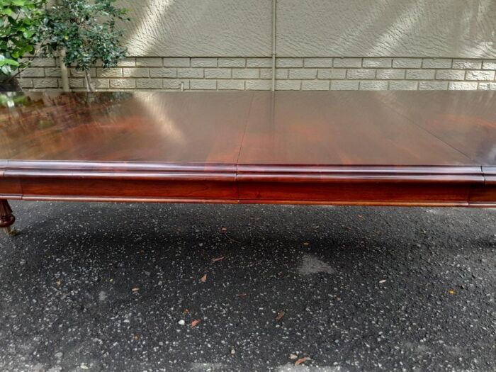 A 20Th Century Mahogany Extending Table with Two Extensions, on Brass Castors with Crank Handle - Image 7