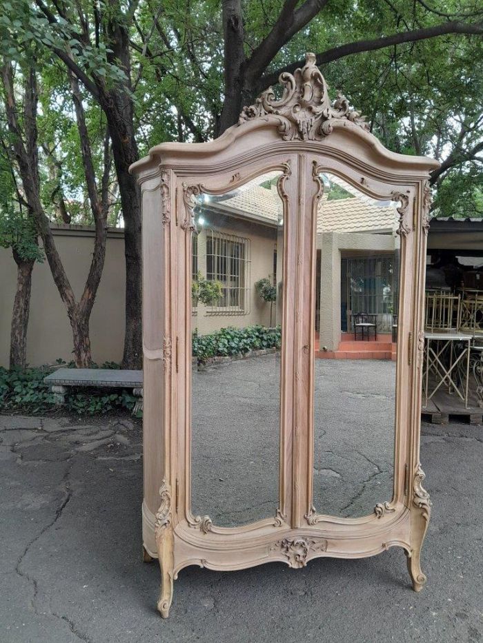 An Antique French Heavily Carved Oakd Two Door Armoire with Bevelled Mirrors and Four Shelves - Image 2