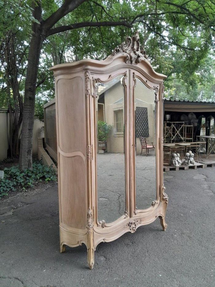 An Antique French Heavily Carved Oakd Two Door Armoire with Bevelled Mirrors and Four Shelves - Image 3