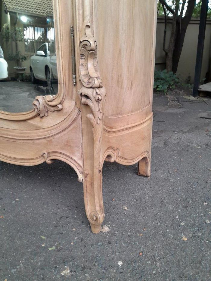 An Antique French Heavily Carved Oakd Two Door Armoire with Bevelled Mirrors and Four Shelves - Image 5