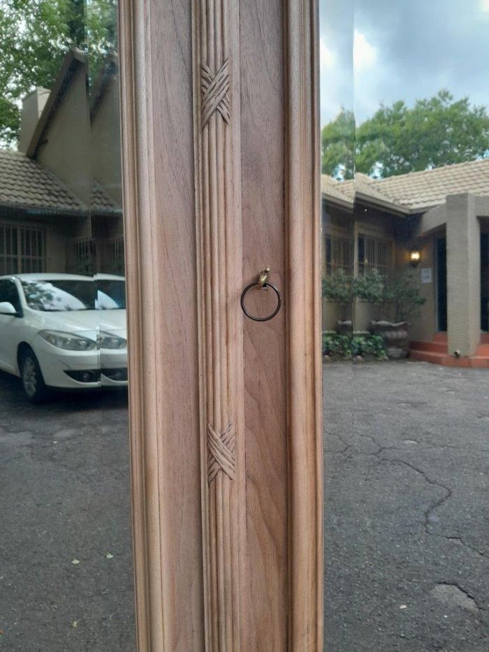 An Antique French Heavily Carved Oakd Two Door Armoire with Bevelled Mirrors and Four Shelves - Image 10