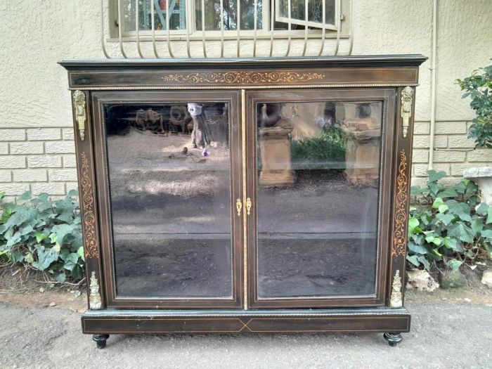 An Antique Circa 1900  French Oak Carved Linen Press (storing linen) / Cabinet/TV Stand with Drawers and Pull-Out Shelves With Artwork inside the Two Doors in a Contemporary Bleached Finish