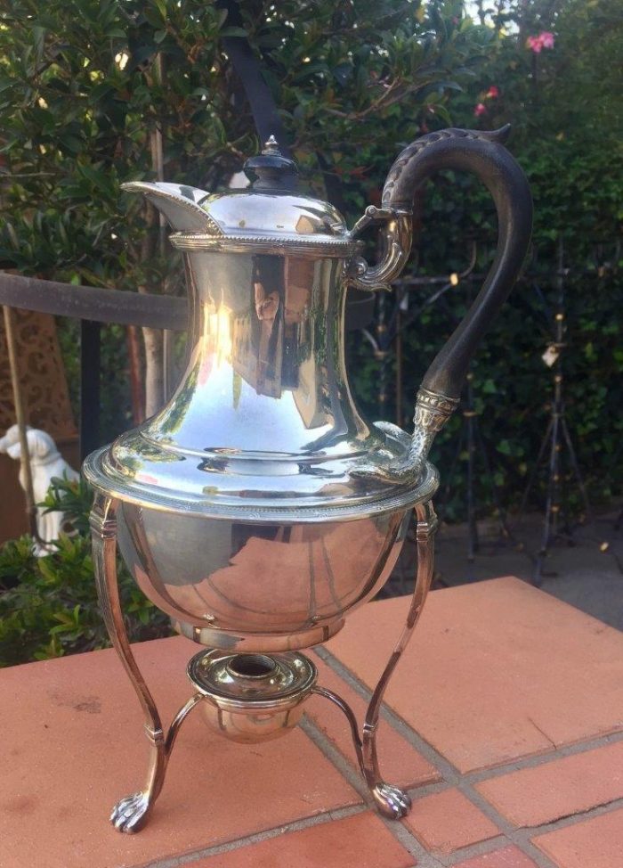 Silver plated tea kettle on stand