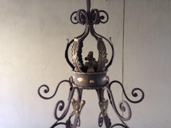 A Large Wrought Iron and Hand-Painted Imported Chandelier with Crown Detail - Image 5