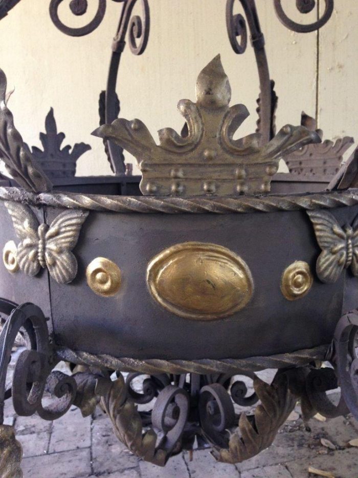 A Large Wrought Iron and Hand-Painted Imported Chandelier with Crown Detail - Image 8