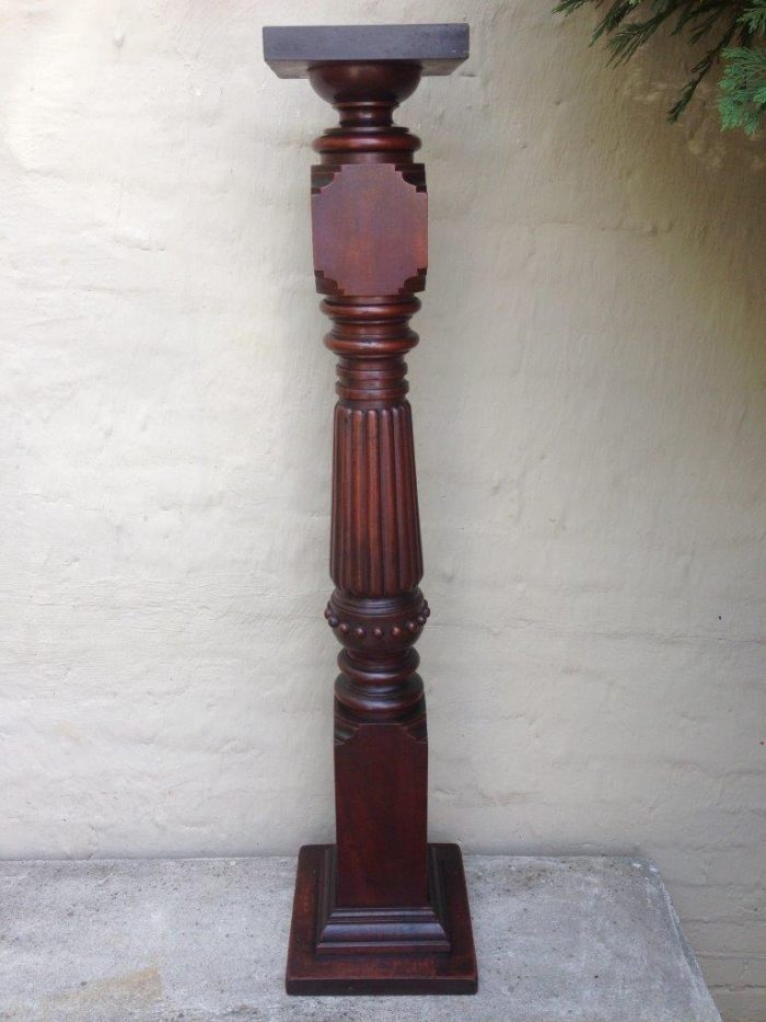 Carved mahogany pillar with fluted stem and square base